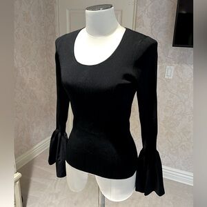 Elizabeth and James long bell sleeve black shirt w/ scoop neckline.